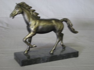 A bronzed figure of a running horse on a marble base 9"