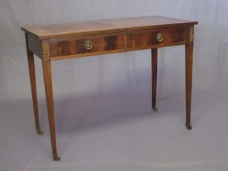 A 19th Century rectangular mahogany side table fitted 2 drawers, raised on square tapering supports ending in brass caps and castors 42"