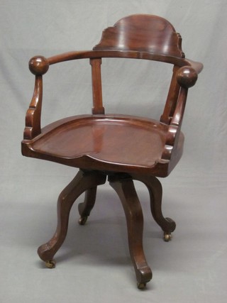 An Edwardian mahogany tub back office chair