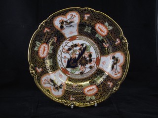 A Royal Crown Derby Imari style plate, the base marked Royal Crown Derby and impressed 6-74 9"
