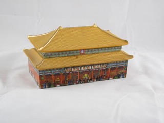 A 20th Century Chinese porcelain musical trinket box in the form of a building the base marked The Palace Museum 4 1/2"