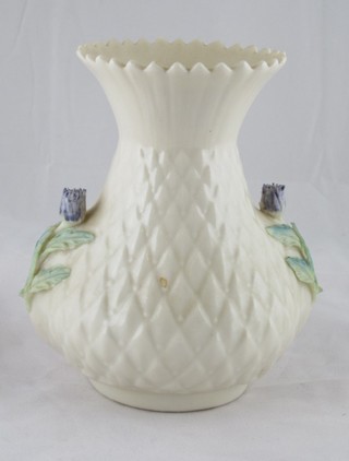 A Beleek twin handled club shaped vase, the handles decorated shamrock, the base with brown Beleek mark 5"
