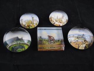 A collection of 5 glass paperweights decorated Crystal Palace, The Lexy Wheel, High Street Oxford, Osborne House and a Harbour