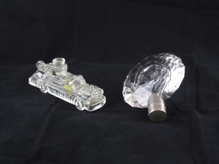 An Art Deco glass scent bottle marked Tresor De Lancome 4 1/2" together with a bottle stopper in the form of an American car 5"