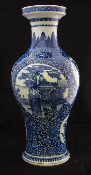 An Oriental blue and white club shaped vase decorated figures 17", neck restored,