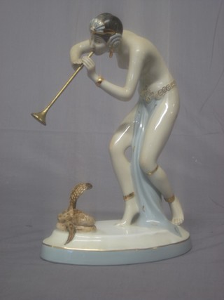 A Royal Dux figure of a lady snake charmer with trumpet 9"