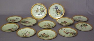 A handsome 12 piece Minton dessert service comprising 2 comports 9" and 10 dessert plates, all with duck egg blue backgrounds, decorated birds and birds nests within gilt banding, some with light contact marks, the bases marked G1215W and impressed Minton, 1 with firing crack to base