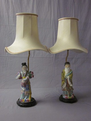 A handsome pair of Oriental porcelain figures mounted as table lamps in the form of a lady and gentleman 12"