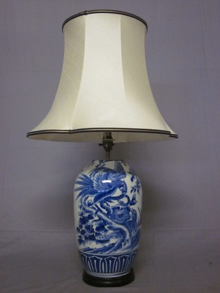 An Oriental porcelain blue and white vase decorated a vase converted for use as table lamp 13"