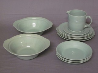 A 14 piece Woods Beryl ware green glazed dinner service comprising 2 9" circular bowls, 5" jug, 2 10" dinner plates, 9" twin handled bread plate, 2 9" side plates, 2 7" tea plates and 4 7 1/2" bowls