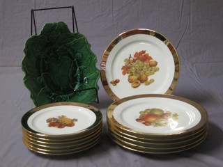 A 19th Century green glazed leaf shaped plate 11" and a 12 piece Bavarian dessert service with gilt banding and fruit decoration comprising 6 9 1/2" plates and 6 8" plates