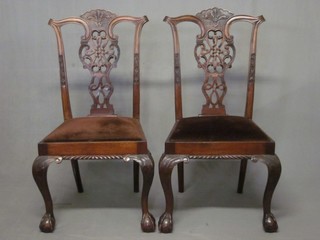 A set of 6 Chippendale style mahogany slat back dining chairs with carved pierced slat backs and upholstered seats, raised on cabriole supports