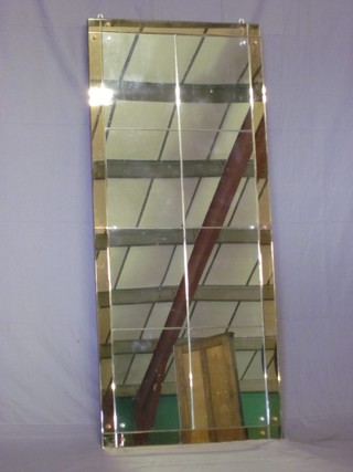 A rectangular Art Deco glass framed mirror consisting of various cut glass panels 64"