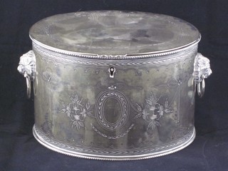 An Edwardian oval engraved silver plated caddy with hinged lid and lion mask handles 7"