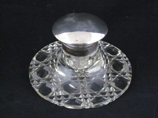 A circular cut glass inkwell with silver mounts and hinged silver lid, Birmingham 1919 4"