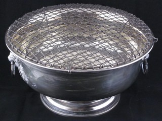 A circular silver plated twin handled rose bowl, raised on a spreading foot 9 1/2"