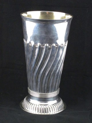 A circular embossed silver plated vase of beaker form 7"