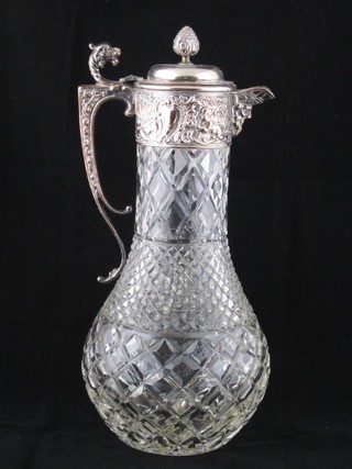 An Edwardian glass claret jug with silver plated mounts