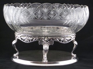An oval cut glass table centre piece raised on a silver plated stand 12"