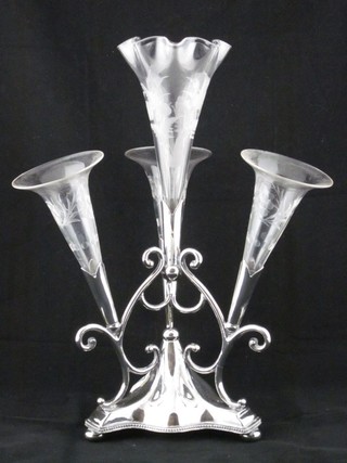 A Britannia metal 4 section epergne with 4 cut glass trumpet shaped epergnes and 1 other cut glass epergne