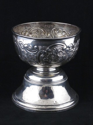 An Edwardian embossed silver pedestal bowl