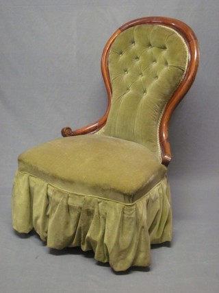 A mahogany show frame nursing chair upholstered in buttoned material, raised on cabriole supports