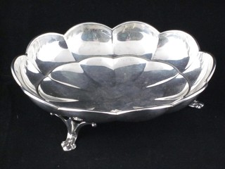 An oval Sterling dish raised on panel supports 6"