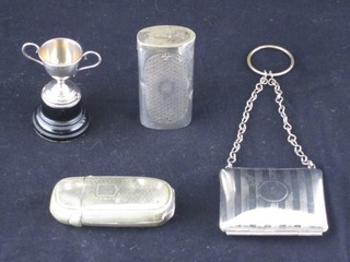A silver plated purse, 2 vesta cases and a miniature silver plated cup