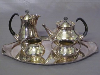 A Mappin & Webb and Elkingtons 5 piece Art Deco style silver plated tea service comprising twin handled tea tray, tea pot, sugar bowl, water jug and cream jug designed by Eric Clementy
