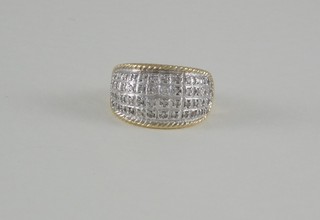 A lady's 14ct yellow gold dress ring set numerous diamonds