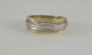 A lady's 14ct yellow and white gold 3 band dress ring set numerous diamonds