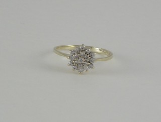 A lady's 9ct gold cluster dress ring set diamonds