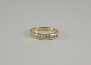 A 9ct yellow gold half eternity ring set diamonds