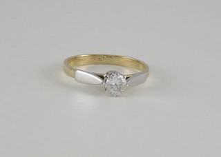 An 18ct yellow gold dress/engagement ring set a solitaire diamond