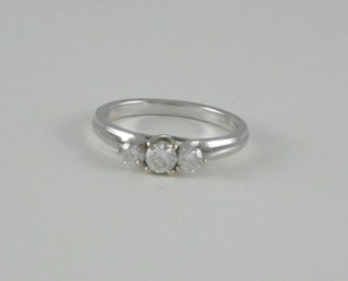 A lady's 18ct white gold dress ring set 3 diamonds