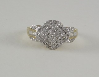 A lady's gold cluster dress ring set diamonds