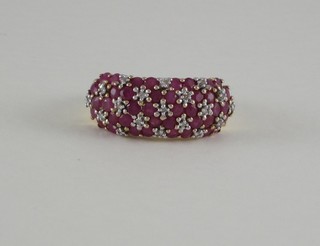 A lady's 9ct gold cluster dress ring set rubies and diamonds