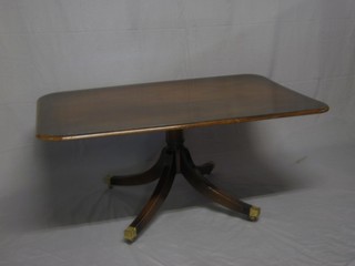 A miniature Georgian style mahogany snap top breakfast coffee table, raised on pillar and tripod supports ending in brass caps and castors 48"