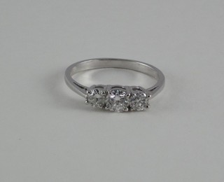 A lady's 18ct white gold dress/engagement ring set 3 diamonds, approx 0.75ct