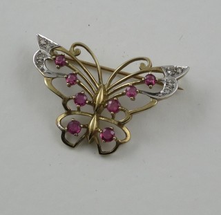 A 9ct gold brooch in the form of a butterfly, the wings set rubies and diamonds
