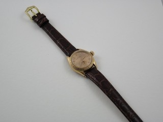 A lady's Rolex Oyster perpetual wristwatch contained in an 18ct gold case