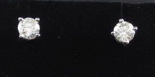 A pair of lady's solitaire ear studs, approx 0.67ct
