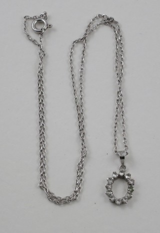 A fine silver chain hung a pendant set white stones