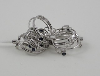 10 Eastern silver dress rings set blue stones