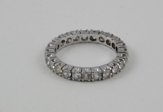 A white metal full eternity ring set white stones