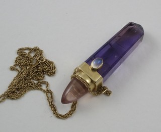 A limited edition amethyst glass pendant with gilt mount, marked 1989, hung on a fine gold chain
