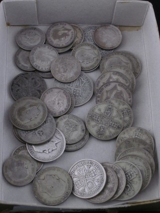 A quantity of George V half crowns, shillings and florins