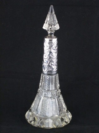 A cut glass perfume flask of conical form with silver bird 8"