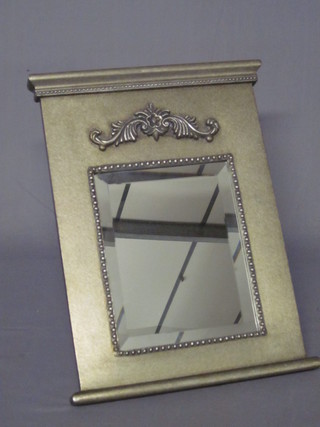 A rectangular bevelled plate mirror contained in a silvered frame  17"