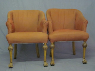 A pair of Queen Anne style walnut tub back chairs upholstered in pink material, raised on club supports